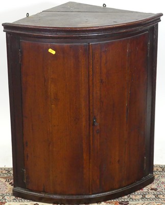 Lot 1334 - A 19th century mahogany bowfront double door...