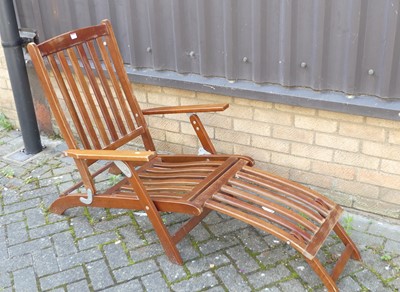 Lot 1345 - A contemporary stained slatted hardwood garden...