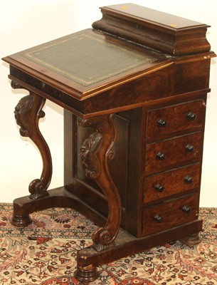 Lot 1257 - A mid-Victorian figured walnut slope front...