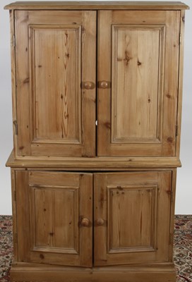 Lot 1258 - A modern pine four door side cupboard, width...