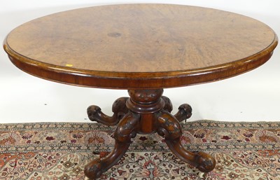 Lot 1277 - A mid-Victorian figured walnut oval tilt-top...