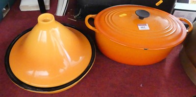 Lot 661 - A Le Creuset orange enamel cooking pot,...