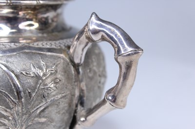 Lot 2066 - A Chinese export silver three-piece tea set,...