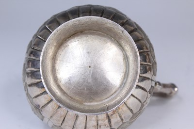 Lot 2066 - A Chinese export silver three-piece tea set,...