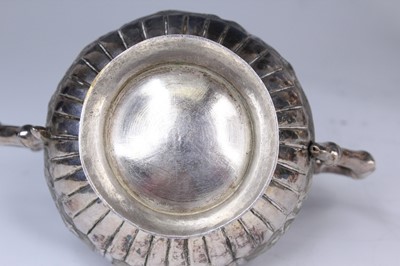 Lot 2066 - A Chinese export silver three-piece tea set,...