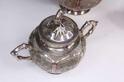 Lot 2066 - A Chinese export silver three-piece tea set,...