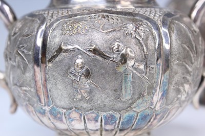 Lot 2066 - A Chinese export silver three-piece tea set,...