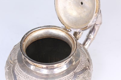 Lot 2066 - A Chinese export silver three-piece tea set,...