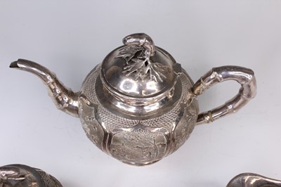 Lot 2066 - A Chinese export silver three-piece tea set,...