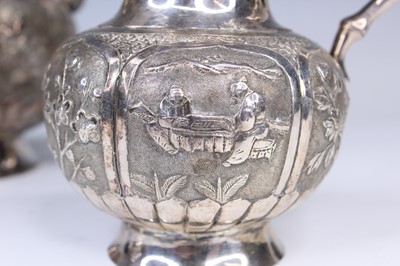 Lot 2066 - A Chinese export silver three-piece tea set,...