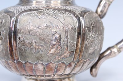 Lot 2066 - A Chinese export silver three-piece tea set,...