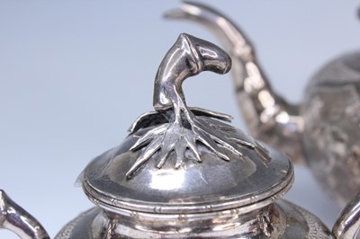 Lot 2066 - A Chinese export silver three-piece tea set,...