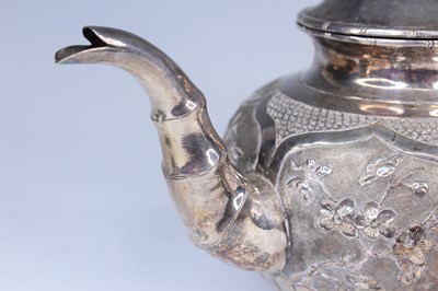Lot 2066 - A Chinese export silver three-piece tea set,...