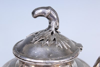 Lot 2066 - A Chinese export silver three-piece tea set,...