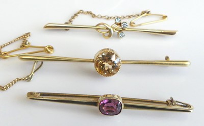 Lot 2298 - Three yellow metal bar brooches, comprising...