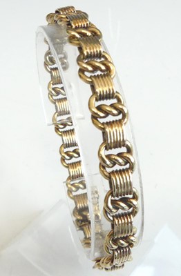 Lot 2310 - A yellow metal fancy knotwork and ridged link...