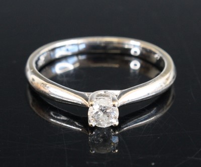 Lot 312 - A white metal diamond solitaire ring, the...