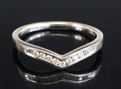 Lot 315 - A 9ct white gold 1.8mm diamond wishbone ring,...