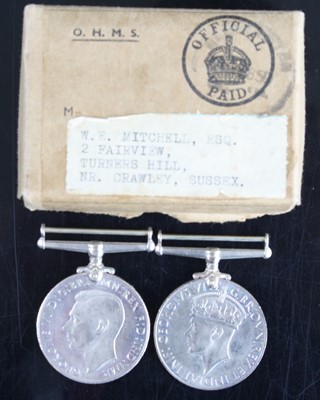 Lot 513 - A pair of WW II medals to include Defence and...