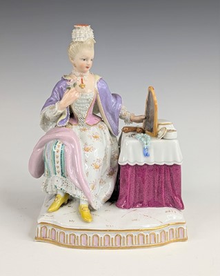 Lot 2066 - A Meissen porcelain figure of a lady sat at...