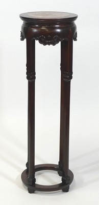 Lot 2453 - A Chinese 'rosewood' jardiniere stand, of...