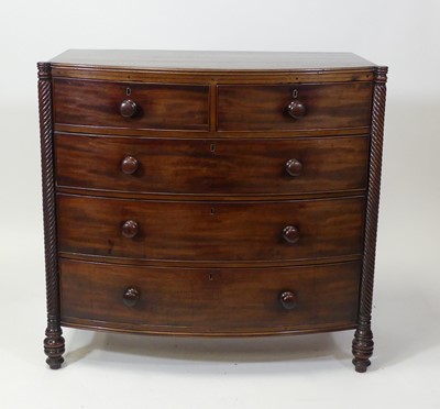 Lot 2619 - A Regency mahogany bowfront chest of two short...