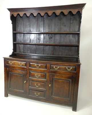 Lot 2575 - A George III joined oak dresser, the...