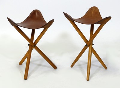 Lot 435 - A pair of 1970s leather topped and beech...