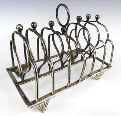 Lot 2116 - A George III silver six-division toast rack,...