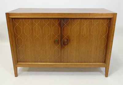 Lot 367 - Gordon Russell - a 1960s double door teak...