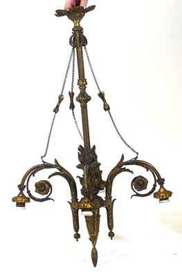 Lot 2593 - A gilt metal four-light electrolier, the...