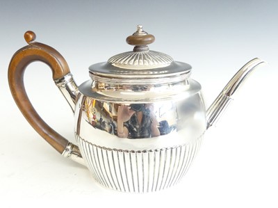 Lot 2227 - A Victorian silver teapot, of half-reeded oval...