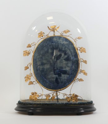 Lot 9 - A Victorian glass dome, upon an ebonised...