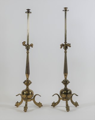 Lot 12 - A pair of brass table lamps, each standing...