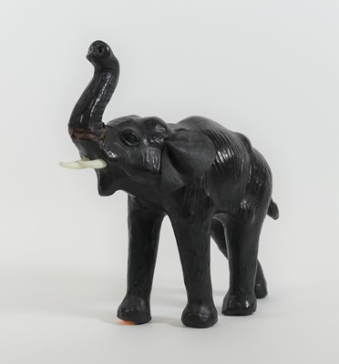 Lot 45 - A leather clad model of an elephant shown...