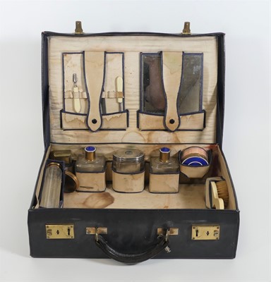 Lot 47 - A blue leather clad travelling vanity case,...