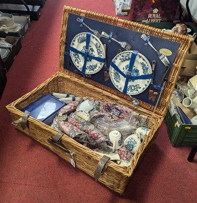 Lot 77 - A vintage wicker picnic hamper, containing...