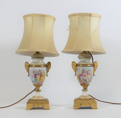 Lot 18 - A pair of porcelain and gilt metal mounted...