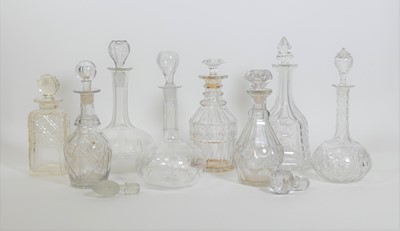 Lot 90 - A collection of eight cut glass decanters,...