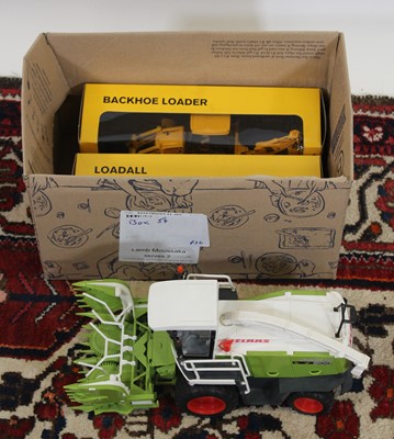 Lot 1569 - A box containing boxed JCB Junior diecast...