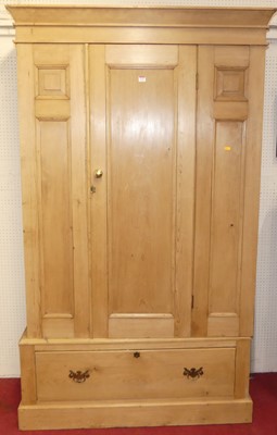 Lot 1122 - A rustic pine single door wardrobe, having...