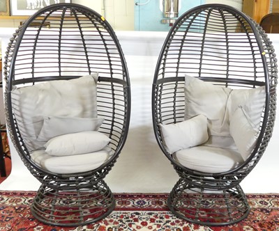 Lot 1125 - A pair of contemporary metal framed and rattan...