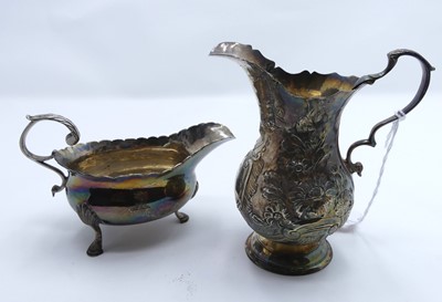 Lot 250 - A silver sauce boat together with a silver...