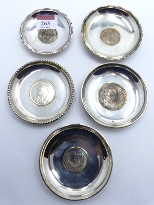 Lot 263 - A collection of five various white metal...