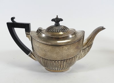 Lot 226 - A Victorian silver teapot, of half-reeded form,...