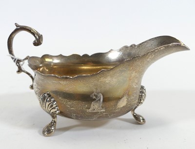 Lot 227 - A George VI silver sauceboat, of helmet shape,...