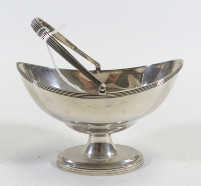 Lot 228 - A George V silver table basket, of navette...