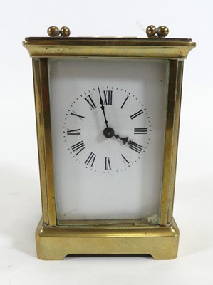 Lot 186 - A brass carriage clock, the enamel dial...