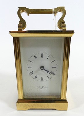 Lot 185 - A brass carriage clock, the dial showing Roman...