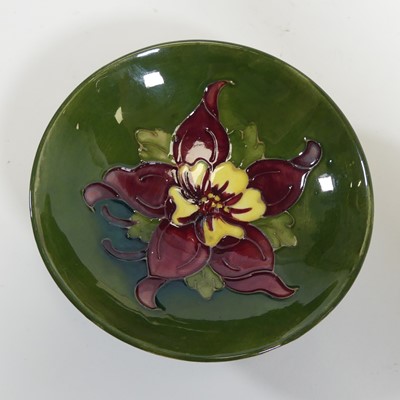 Lot 184 - A Moorcroft Columbine pattern dish, dia. 11cm